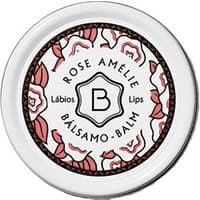 Round tin of Benamor Rose Amelie lip balm with floral design and black text on white background.