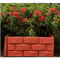 Red brick effect garden border set of 4, textured surface, interlocking design, placed in front of lush greenery.