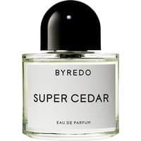 Clear glass bottle of Byredo Super Cedar perfume with black cap and white label.