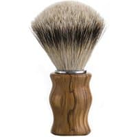 Carthusia beard brush with natural wood handle and dense, soft bristles for all skin types.