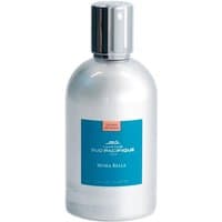 Clear glass bottle with silver cap, blue label, and orange logo, containing Mora Bella Eau de Toilette, 100 ml.