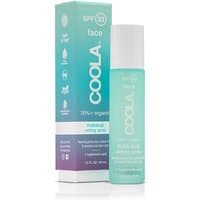 Coola Makeup Setting Spray SPF 30, turquoise bottle with white cap, next to matching box with gradient design.