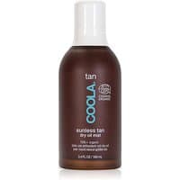 Brown Coola Sunless Tan Dry Oil Mist bottle with white cap, blue logo, and 100 ml label.