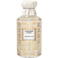 Clear glass bottle of Creed Aventus Eau de Parfum, 490 ml, with white label, gold accents, and white cap.