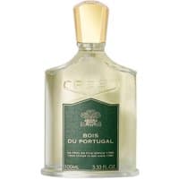 Clear glass bottle of Creed Bois du Portugal Eau de Parfum with gold cap and green label, 100 ml men's woody fragrance.