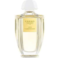 Clear glass bottle of Creed Iris Tubereuse Eau de Parfum, 100 ml, with a white cap and gold label.
