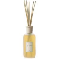 Clear glass bottle with beige cap, filled with yellow liquid, and wooden reeds; labeled "Culti Stile Diffusore 250 ml."