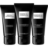 David Mallett Travel Box N1 set with black tubes of mask, shampoo, and conditioner, each labeled for hydration.
