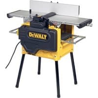 Yellow DeWalt planer thicknesser with black accents, 2100W motor, sturdy metal stand, and adjustable cutting table.