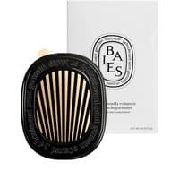 Black oval Diptyque car diffuser with gold vents, Baies label, and white packaging box.