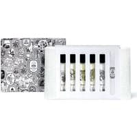 Diptyque Discovery Set with five clear vials, black caps, in a white box with intricate black illustrations.