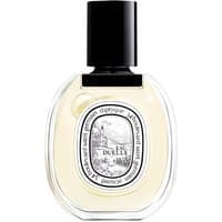 Clear glass bottle of Diptyque Eau Duelle Eau de Toilette, black cap, oval label with intricate black and white design.