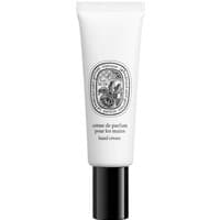 White tube of Diptyque Eau Rose hand cream with black cap and ornate oval label design.