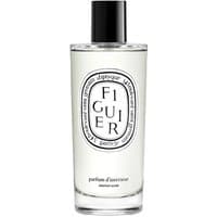 Clear glass bottle of Diptyque Figuier floral room spray with black cap and oval label.