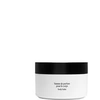 White Diptyque Fleur de Peau body balm jar with black lid and minimalist label design.