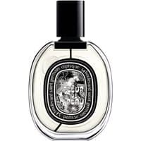 Clear glass bottle with black cap, oval label featuring intricate design, "Fleur de Peau" text, 75 ml unisex perfume.
