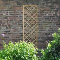 Wooden lattice trellis with diamond pattern, 6' x 2', against a brick wall surrounded by greenery.