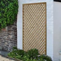 Wooden diamond lattice panel, pressure treated, 6' x 4', with a natural finish, set against a white brick wall.