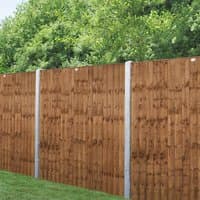 Brown pressure-treated vertical closeboard fence panel with wooden slats, 6' x 6', against a green foliage backdrop.