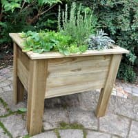 Wooden garden planter with natural finish, 3'x2', filled with herbs, elevated on four sturdy legs.