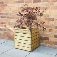 Square wooden garden planter with horizontal slats, natural finish, containing a small tree, placed on a patio.