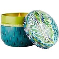 Fragonard citrus candle in a teal tin with green leaf pattern and matching lid.