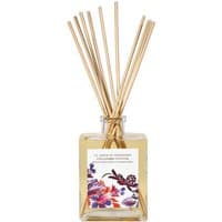 Square glass bottle with wooden reeds, floral label, and amber liquid, Fragonard Gingembre Vetiver Spicy Diffuser.