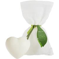 Heart-shaped white soap with green ribbon, packaged in a white drawstring bag.