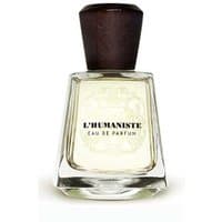 Clear glass bottle with dark wooden cap, labeled "L'Humaniste Eau de Parfum" by Frapin, 100 ml men's aromatic perfume.