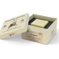 Beige Gamila Secret cleansing bar in an open cream box with black interior, labeled for sensitive skin.