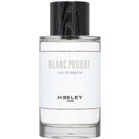 Clear glass bottle of Heeley Blanc Poudre Eau de Parfum, black cap, white label with black text, unisex floral scent.