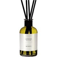Amber glass bottle with white label, black reeds, "Laboratorio Olfattivo - Agrumeto Diffuser 500 ml" text.