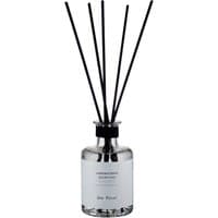Clear glass diffuser with black reeds, silver cap, and white label reading "Laboratorio Olfattivo - Che Fico!"