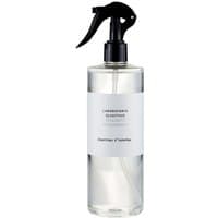 Clear bottle of Laboratorio Olfattivo Giardino d'Inverno woody room spray with black trigger nozzle, 500 ml.