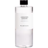 Clear bottle with black cap, white label reading "Laboratorio Olfattivo MeloMirtillo Diffuser 500 ml Refill."