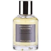 Clear glass bottle with silver cap, gray label reading "Laboratorio Olfattivo Tuberosis," containing yellow perfume.