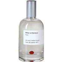 Clear glass bottle with silver cap, white label, and red dot, containing Miller et Bertaux unisex woody Eau de Parfum.