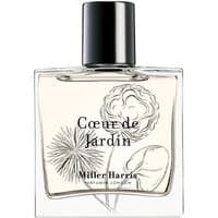 Clear glass bottle of Miller Harris Coeur De Jardin Eau de Parfum with floral illustrations and black cap.