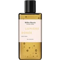 Miller Harris Lumiere Doree Body Wash 250 ml in a clear amber bottle with black cap and minimalist label design.