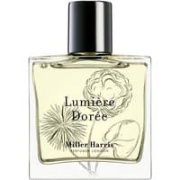 Square glass bottle of Miller Harris Lumiere Doree perfume, black cap, floral illustrations, and citrus scent label.