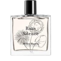 Clear glass bottle of Miller Harris Rose Silence Eau de Parfum, black cap, floral illustrations on label.