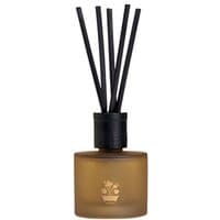 Amber glass diffuser with black reeds and a floral emblem, Noble Isle Whisky & Water, woody scent.