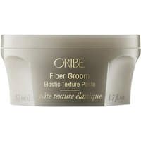 Beige Oribe Fiber Groom 50 ml jar, elastic texture paste for volume and styling, gold lettering on lid.