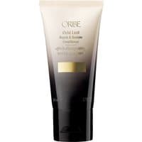 Oribe Gold Lust Repair Conditioner, travel size, black and gold gradient tube with gold label and black cap.
