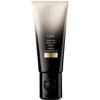Black and gold Oribe hair masque tube, 150 ml, with gradient design and black cap.