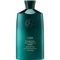 Teal Oribe Priming Lotion Leave-In Conditioning Detangler, 250 ml bottle with embossed logo and sleek design.