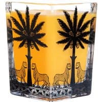 Square amber candle with black palm tree and leopard design on transparent glass by Ortigia, 170 g.