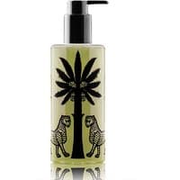 Clear bottle of Ortigia Bergamotto Shower Gel with black palm tree and leopard design, black pump top.