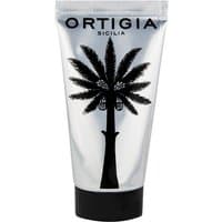 Silver tube of Ortigia Fico d'India hand cream with black palm tree design and black cap.