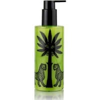 Green Ortigia Fico d'India shower gel bottle with black pump, palm tree, and leopard design.